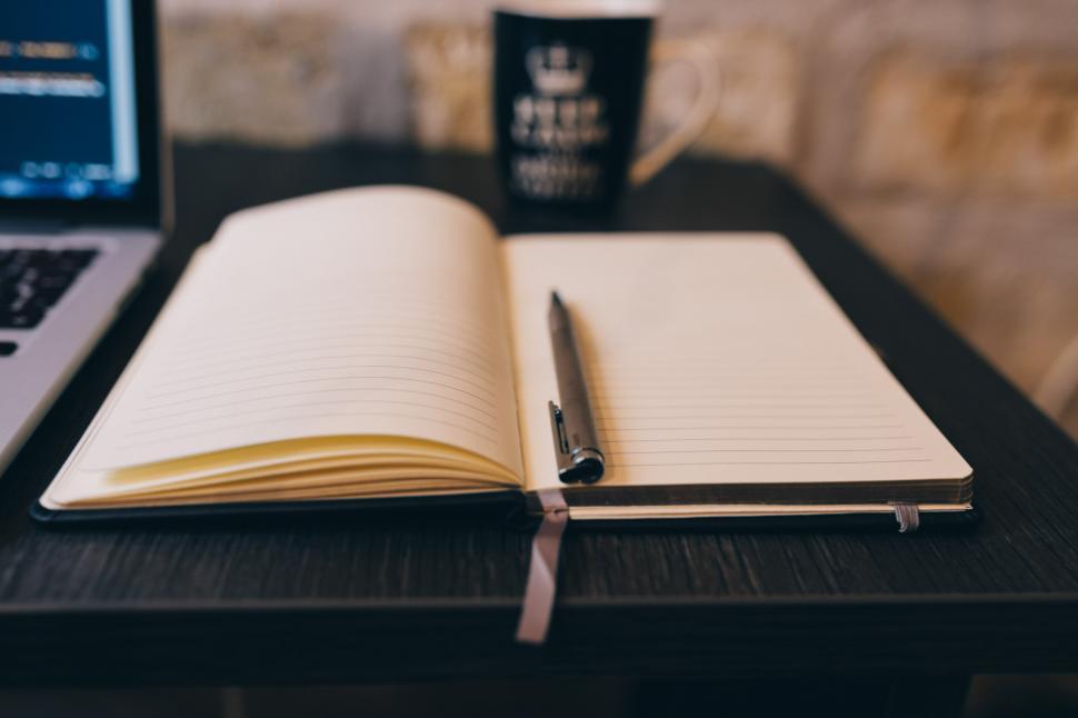 Free Image of Notebook and Laptop on Table 