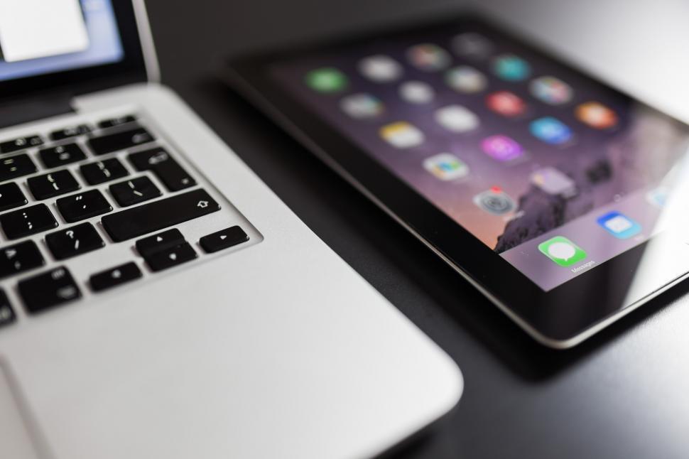Free Image of Two Laptops Close Up on Table 