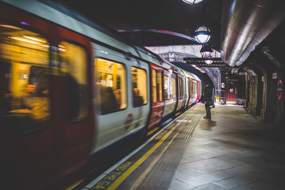 Free Image of Train Pulling Into Train Station Next to Platform 