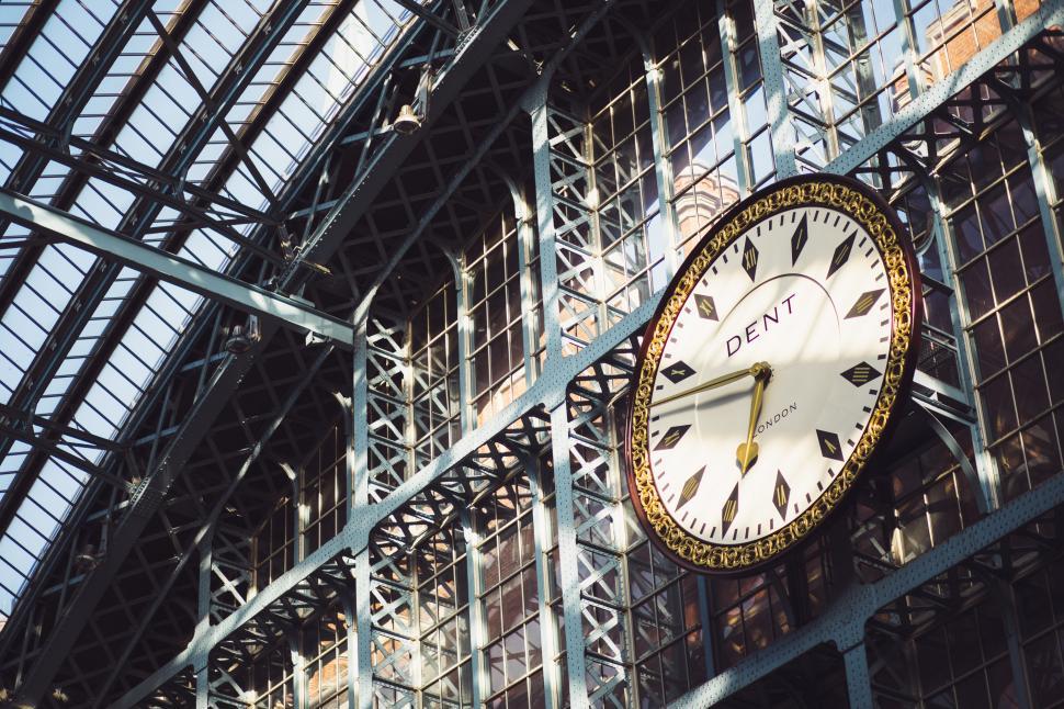 Free Image of Large Clock Mounted to Side of Building 