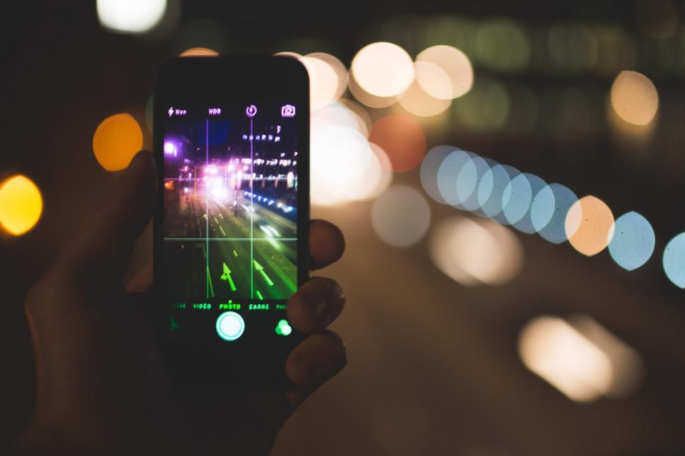 Free Image of Person Taking Picture of Night Street 