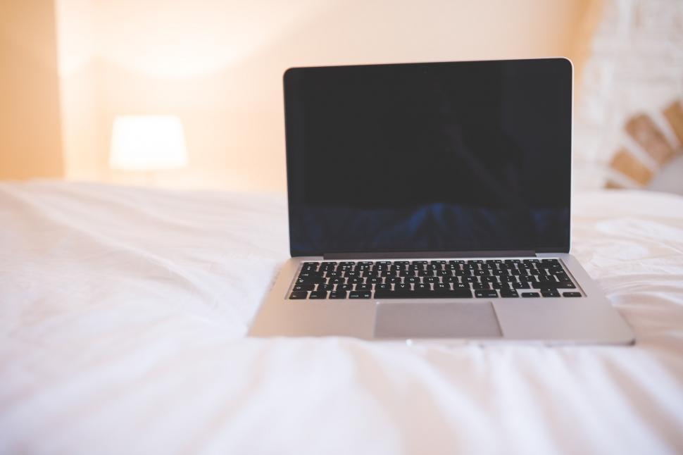 Free Image of Laptop Computer on White Bed 