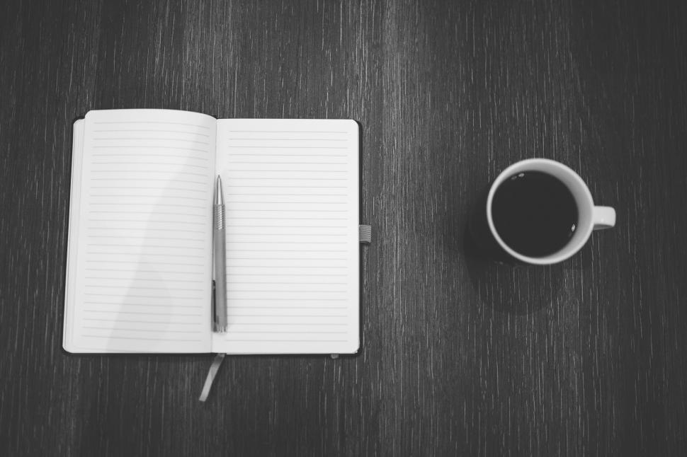 Free Image of Coffee Cup and Notebook on Table 