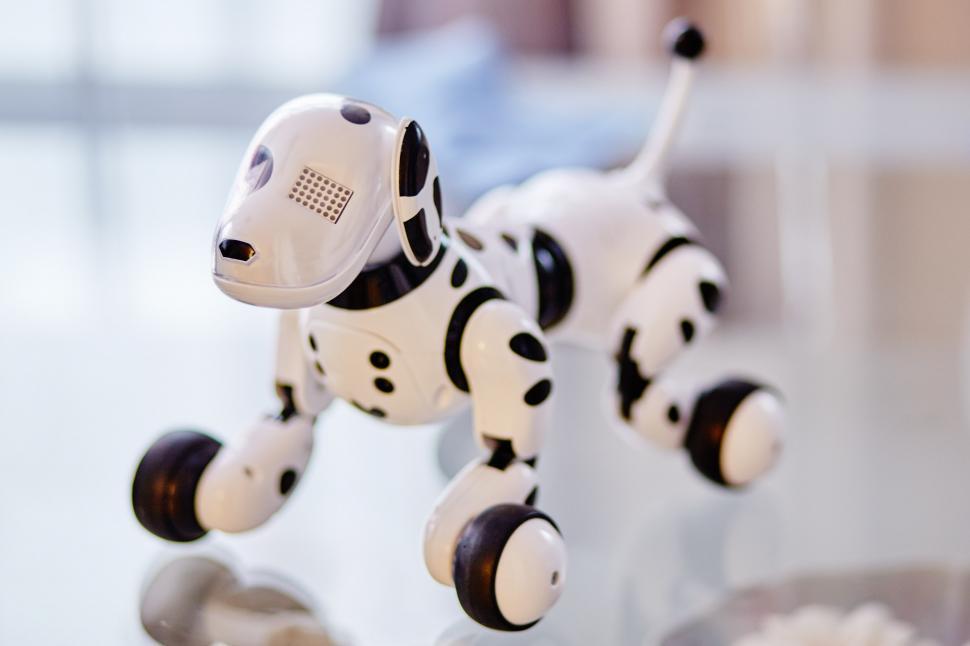 Free Image of Toy Dog Sitting on Table 