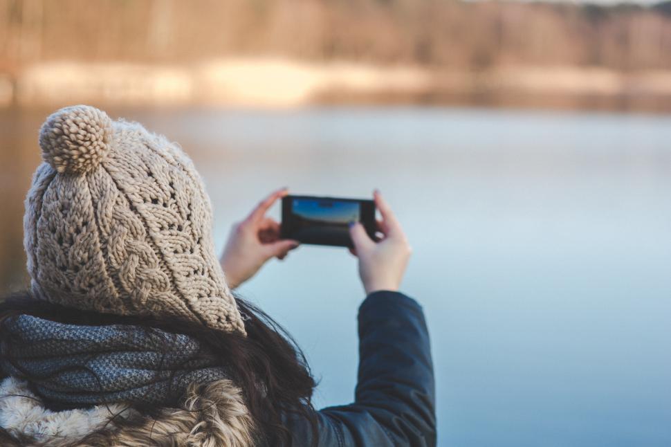 Free Image of Person Capturing Body of Water on Camera 