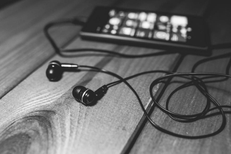 Free Image of Pair of Headphones on Wooden Table 