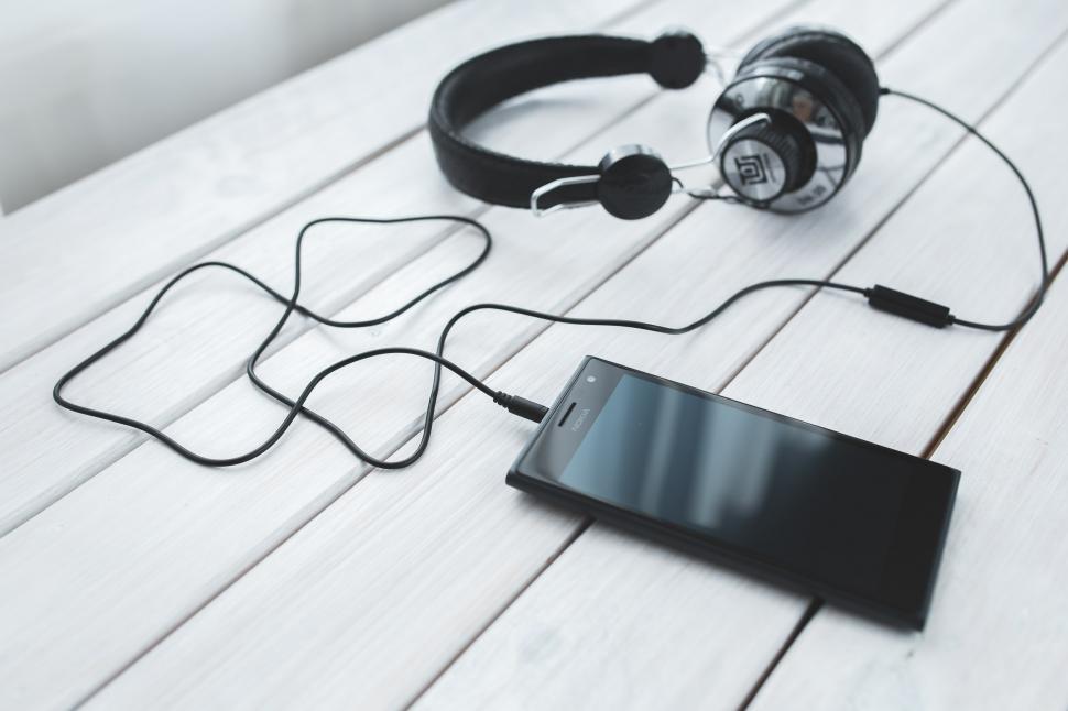 Free Image of Headphones Resting on Wooden Floor 