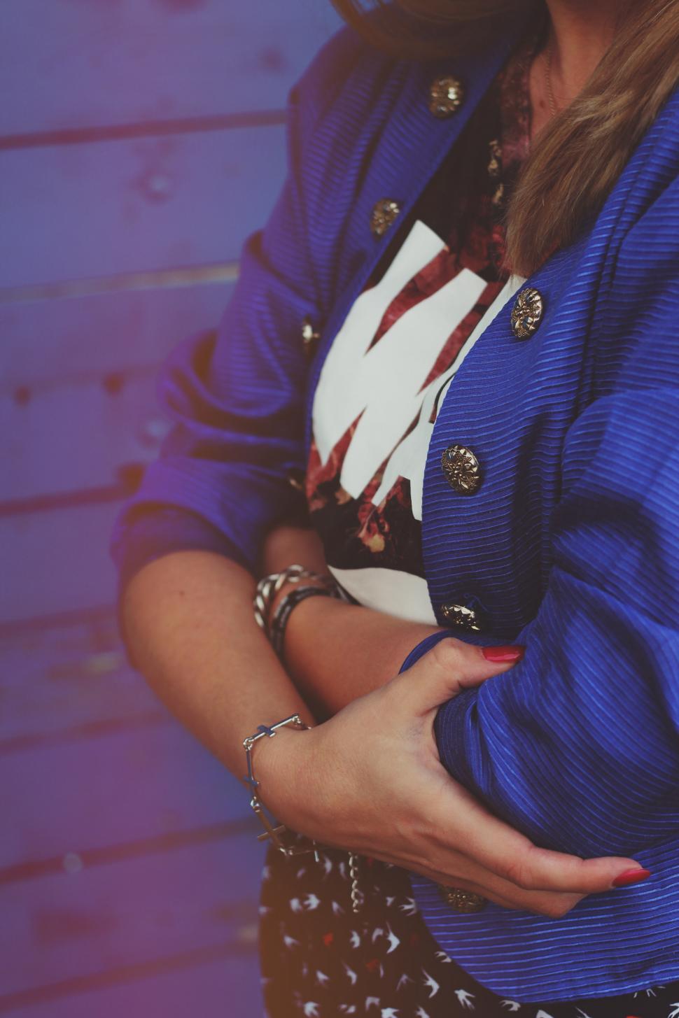 Free Image of Woman in Blue Jacket Standing With Arms Crossed 