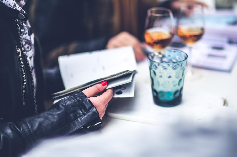 Free Image of Woman Sitting at Table With Two Glasses of Wine 