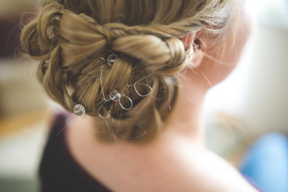 Free Image of Close Up of Womans Hair in a Bun 