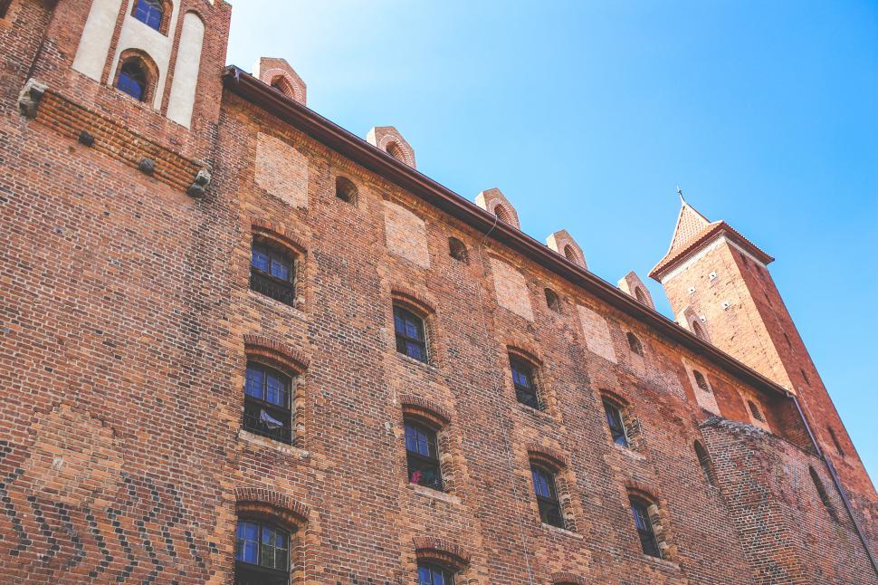 Free Image of Tall Brick Building With Clock Tower 