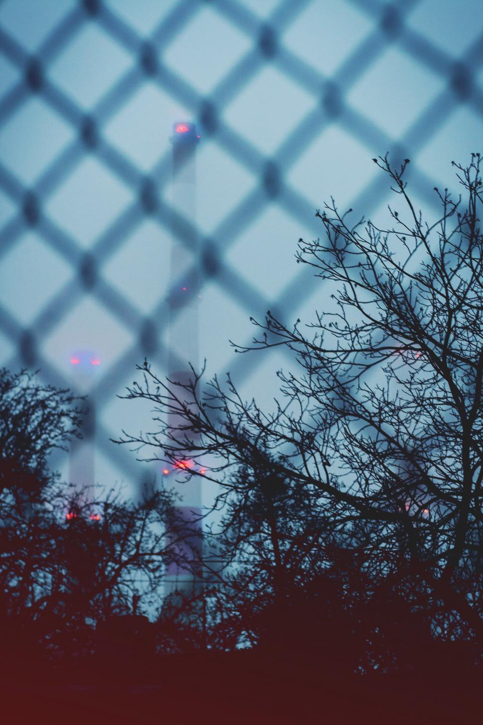 Free Image of View of the Eiffel Tower Through Fence 