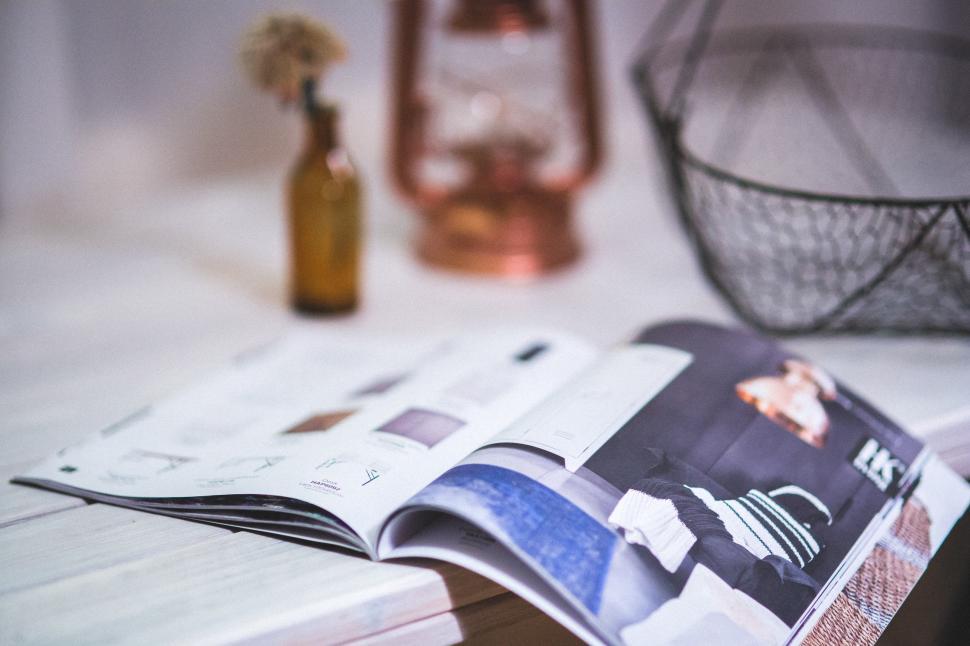 Free Image of Open Magazine on Table 