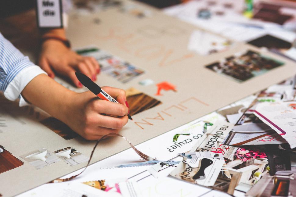 Free Image of Person Writing With Pen and Paper on Table 