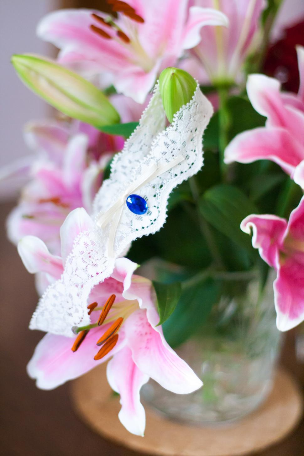Free Image of Vase Filled With Pink Flowers on Wooden Table 