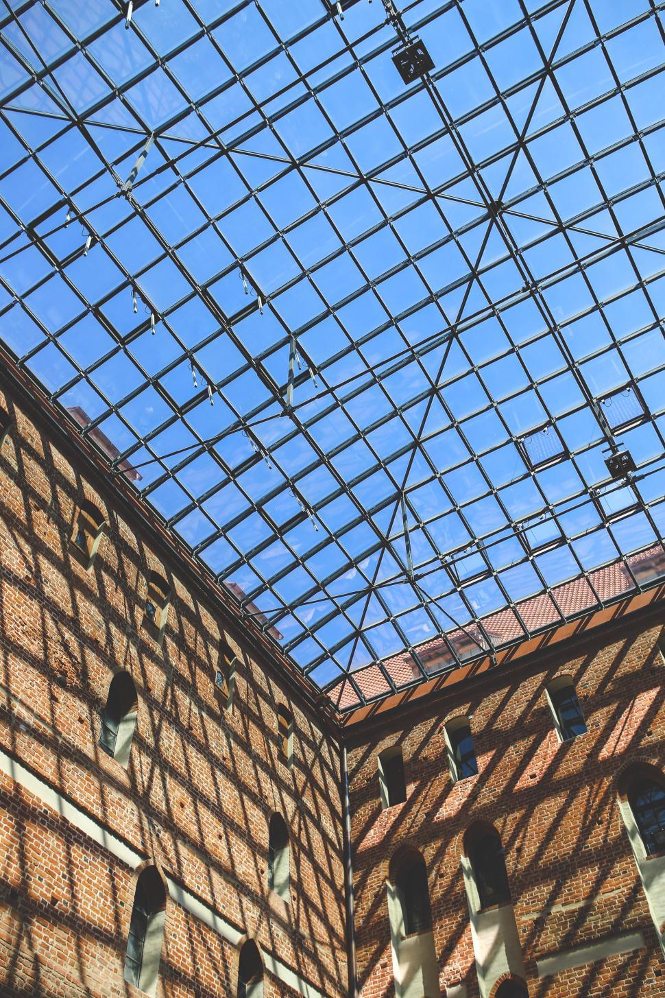 Free Image of Modern Building With Glass Roof and Clock 