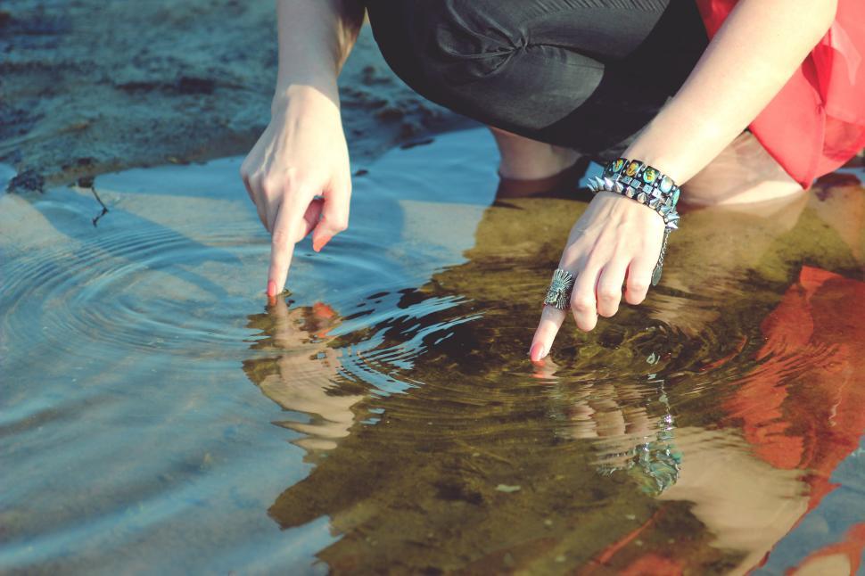 Free Image of Woman Kneeling in Body of Water 