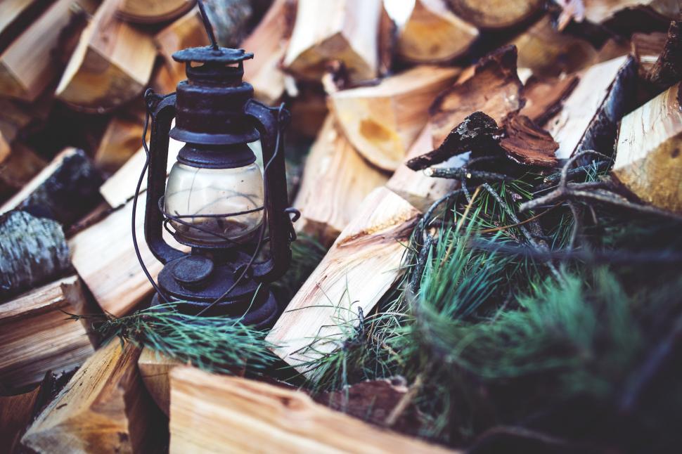 Free Image of Lantern on Pile of Wood 