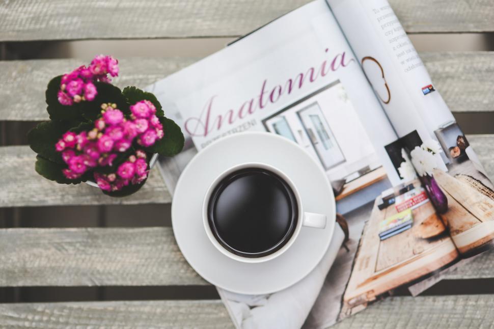 Free Image of A Cup of Coffee and a Magazine on a Bench 