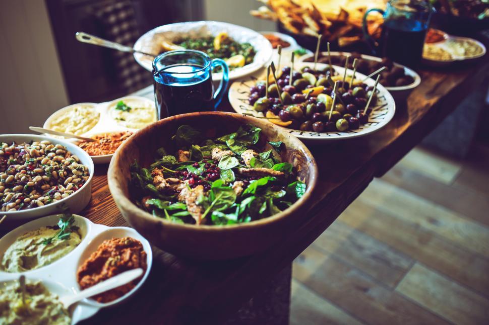 Free Image of Wooden Table Laden With Plates of Food 