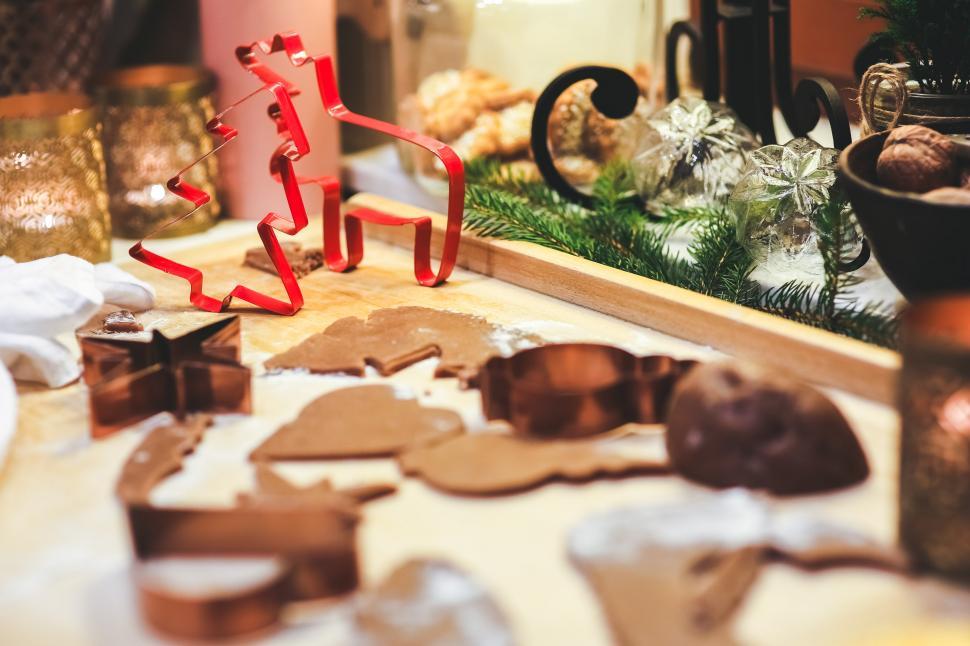 Free Image of Wooden Cutting Board With Cut Out Cookies 