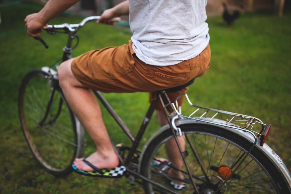 Free Image of Man Riding Bike in Grass 