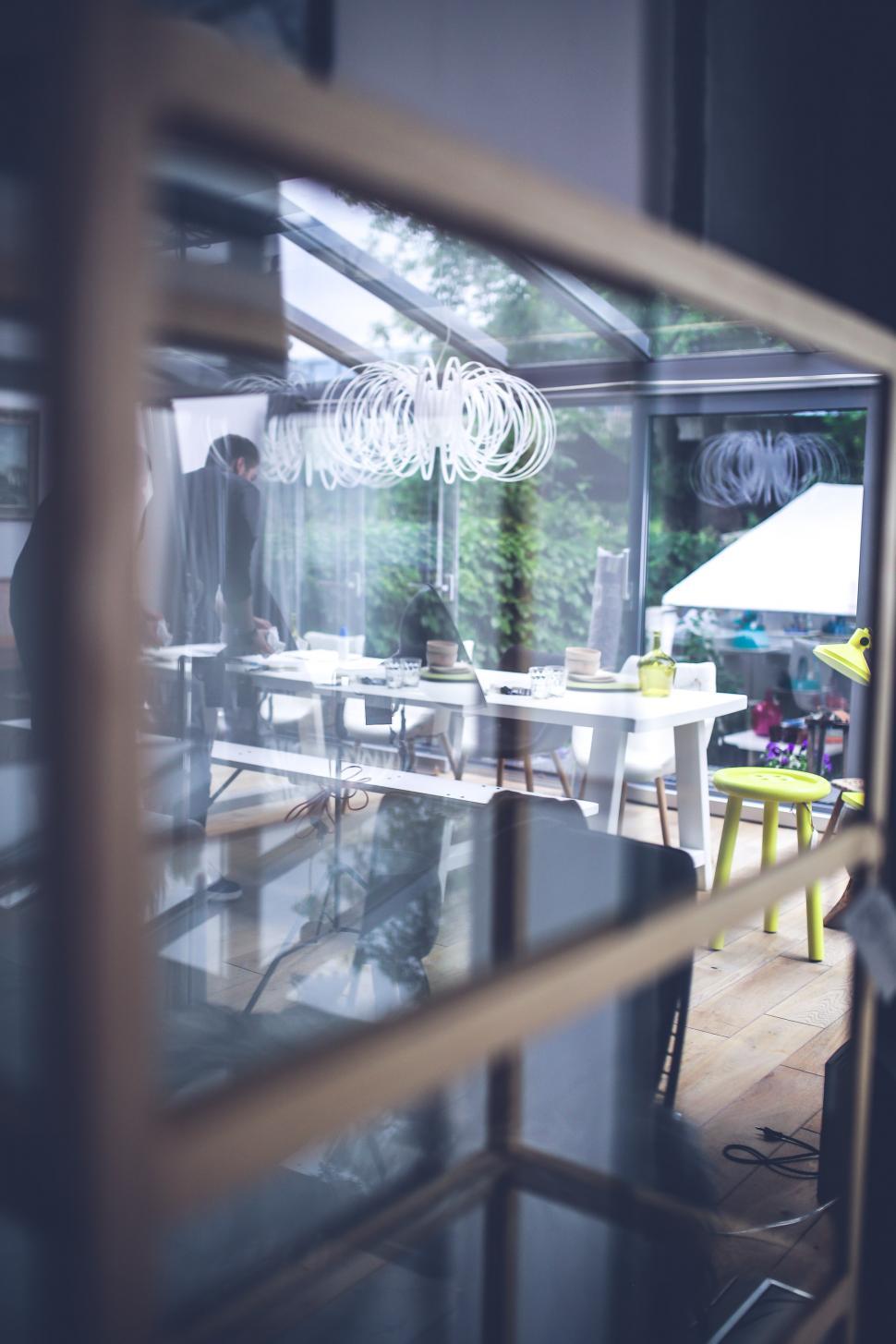 Free Image of A View of a Dining Room Through a Window 