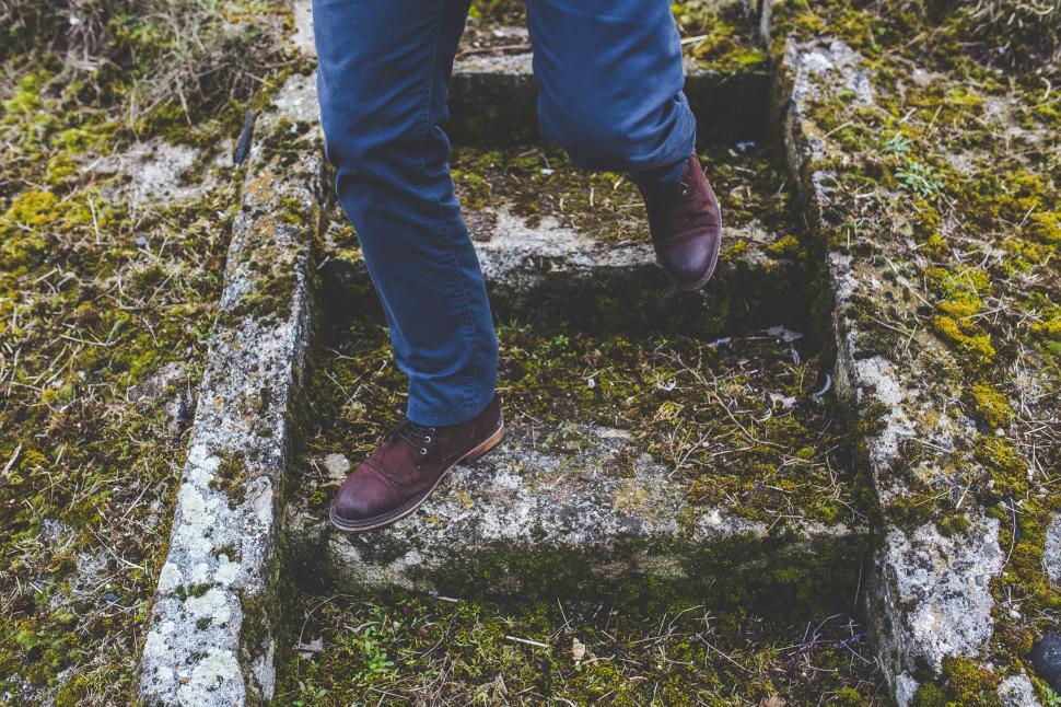 Free Image of Person Walking Up Steps in Grass 