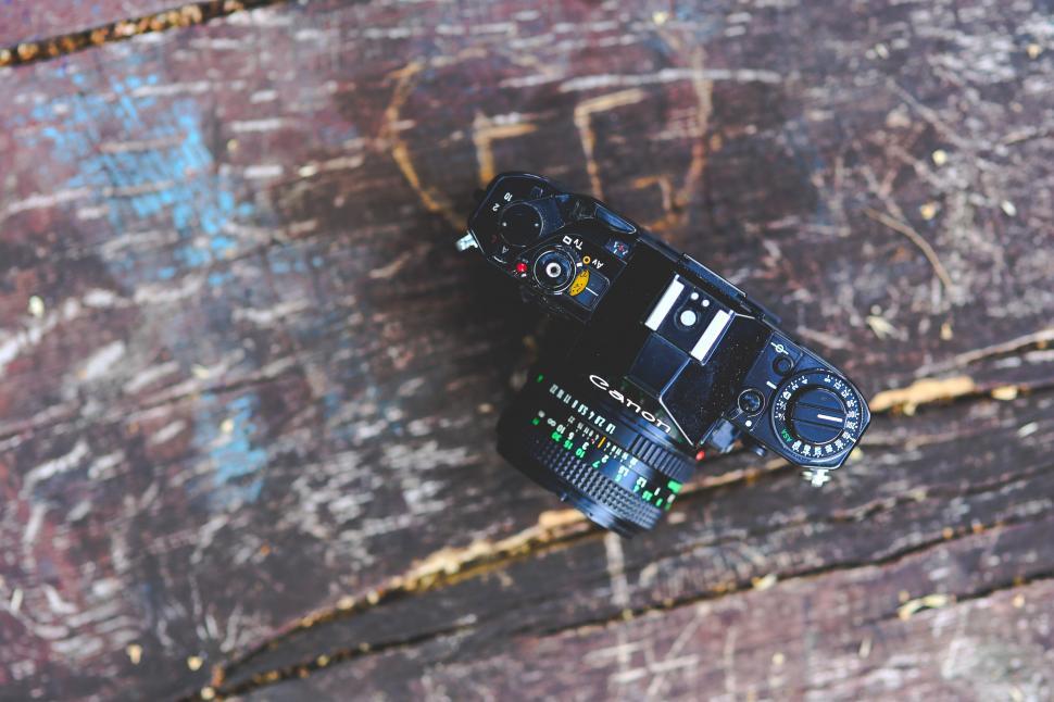 Free Image of Camera on Wooden Table 