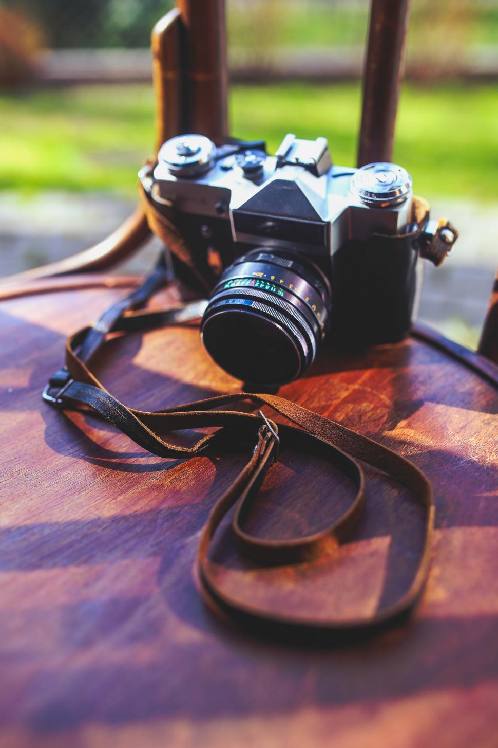 Free Image of Camera on Wooden Table 