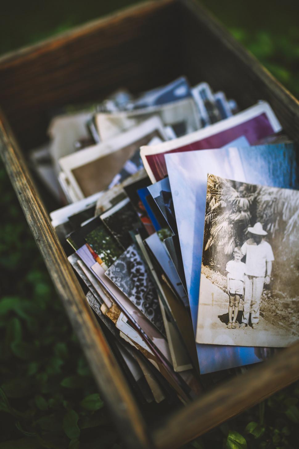 Free Image of Wooden Box Filled With Photos 
