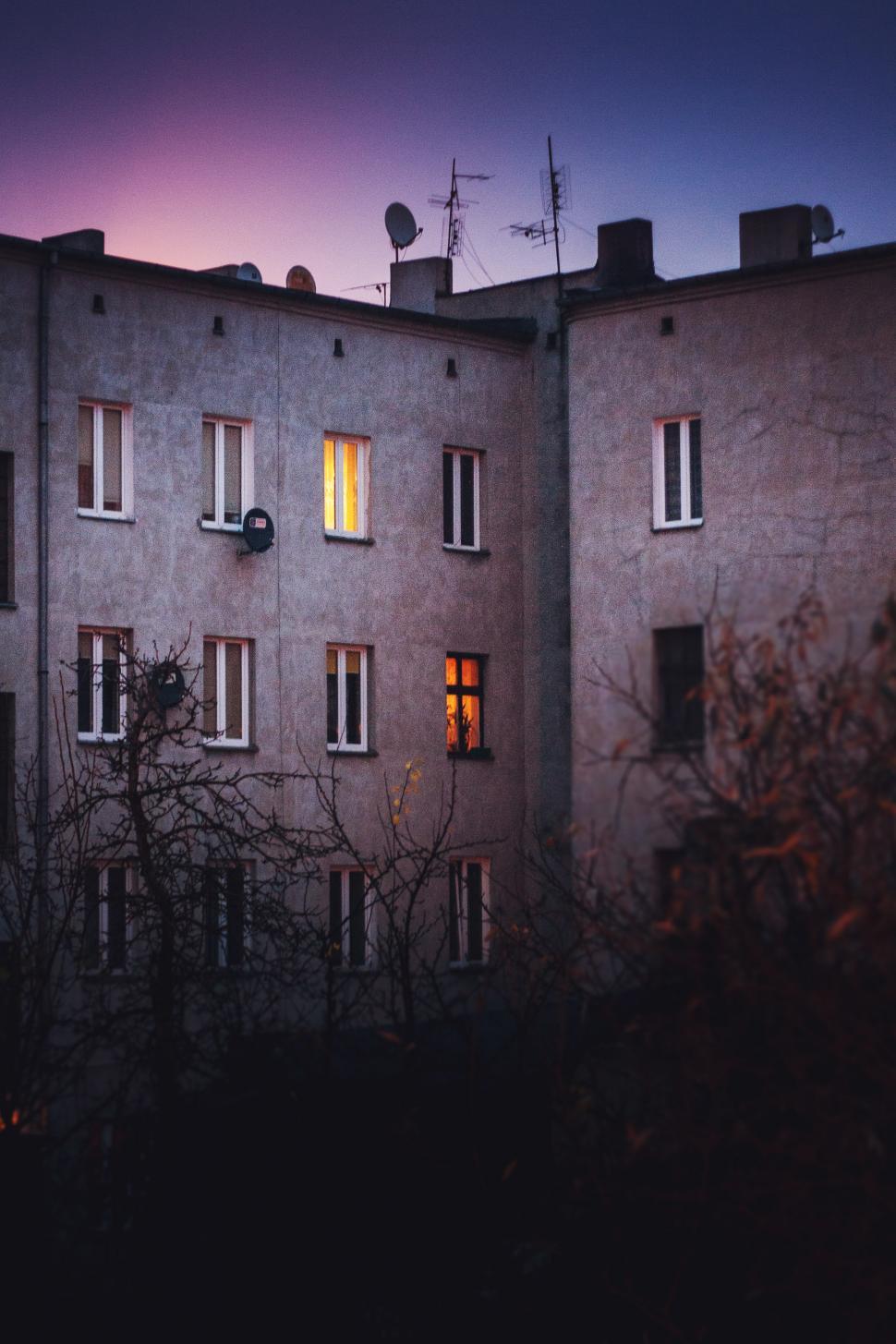 Free Image of Urban Skyscraper Illuminated by Windows at Night 