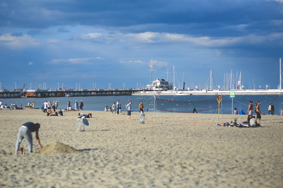 Free Image of A Group of People Playing Volleyball on a Beach 