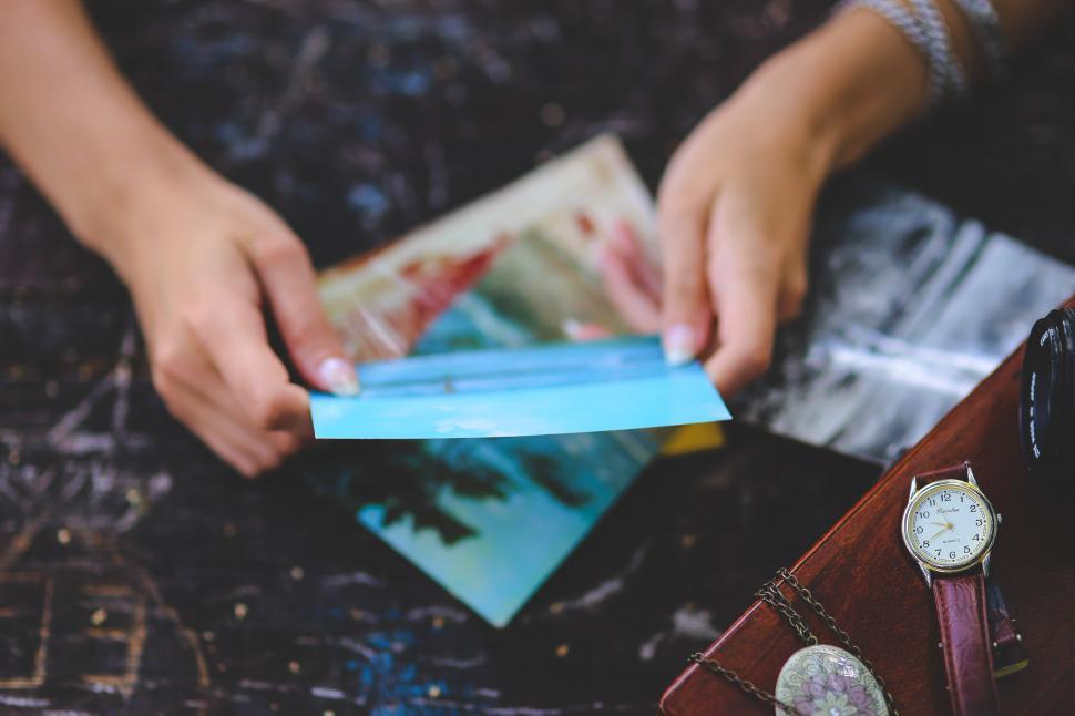Free Image of Person Holding Blue Paper 