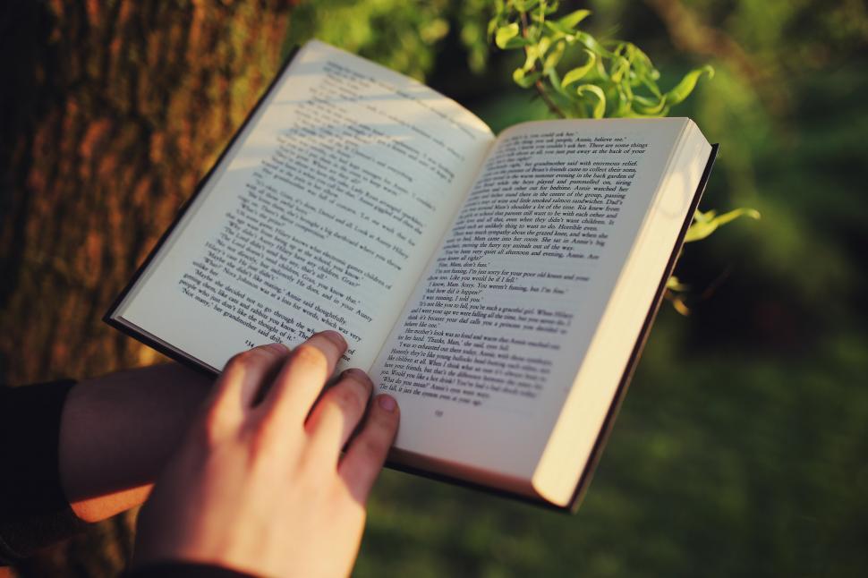 Free Image of Person Holding a Book in Hands 