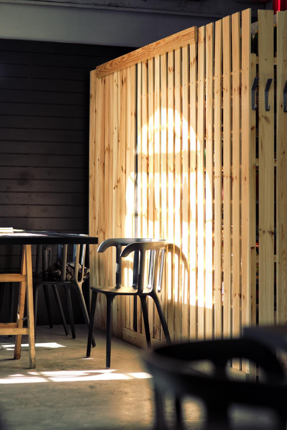 Free Image of Wooden Wall Room With Table and Chairs 