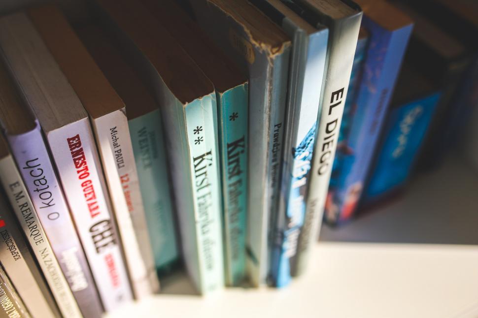 Free Image of Row of Books on White Shelf 