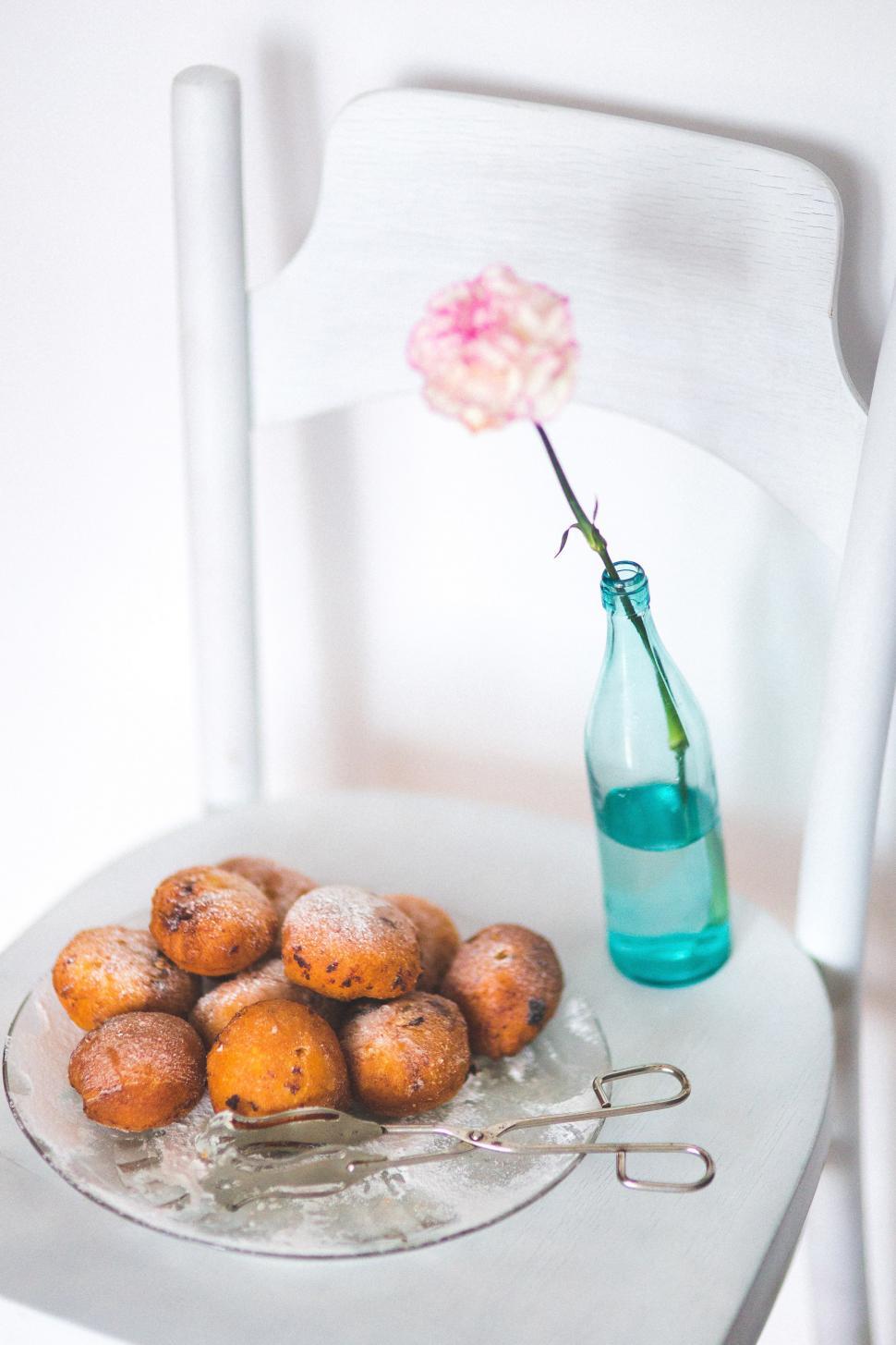 Free Image of Plate of Food on Chair Next to Bottle of Water 