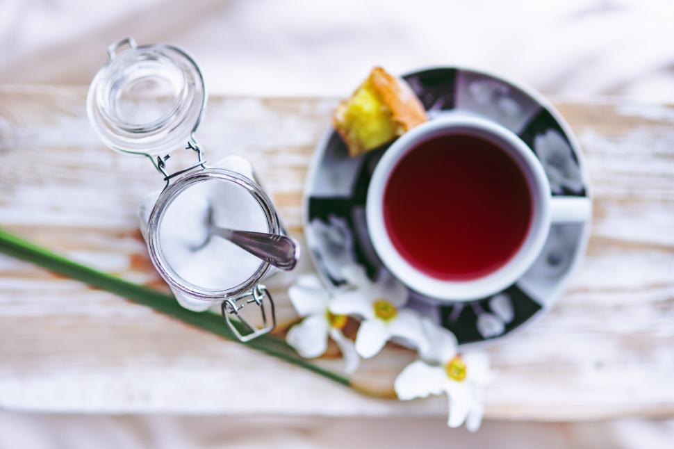 Free Image of A Cup of Tea and Flower on Table 