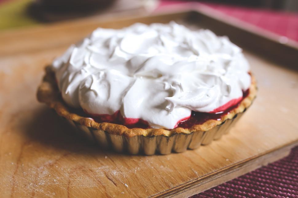 Free Image of Pie on Wooden Cutting Board 