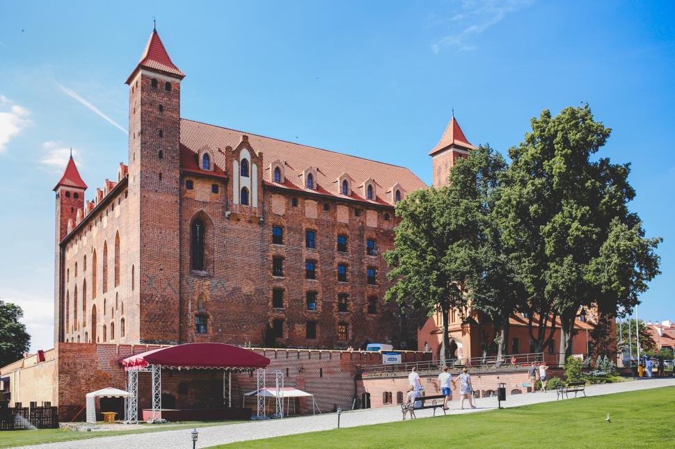 Free Image of Large Brick Building With Red Roof 