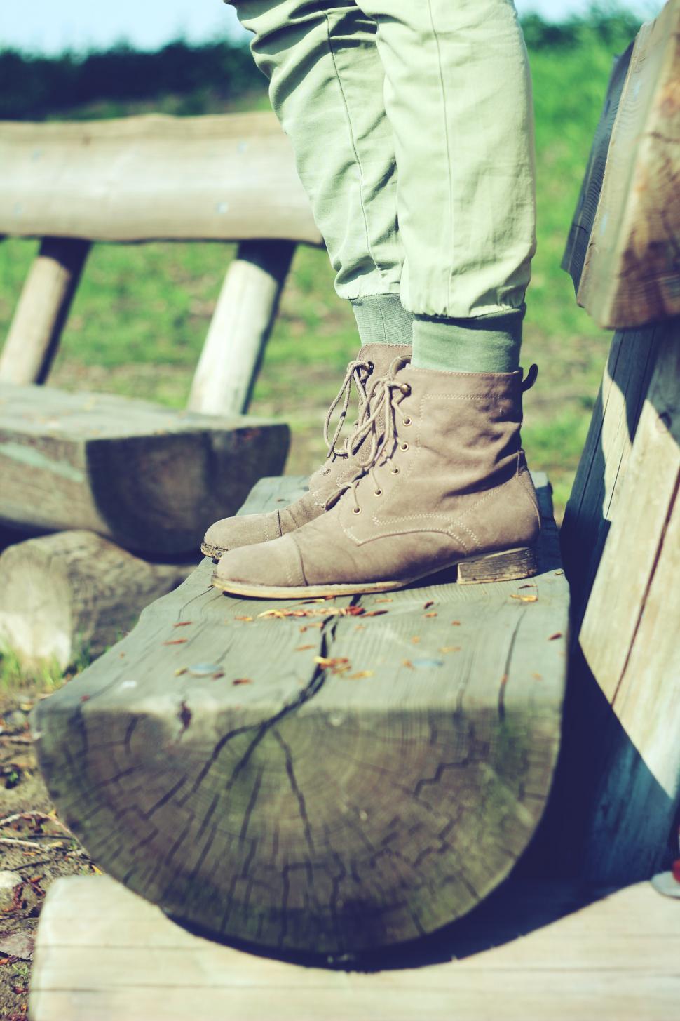 Free Image of Person Standing on Top of Wooden Bench 