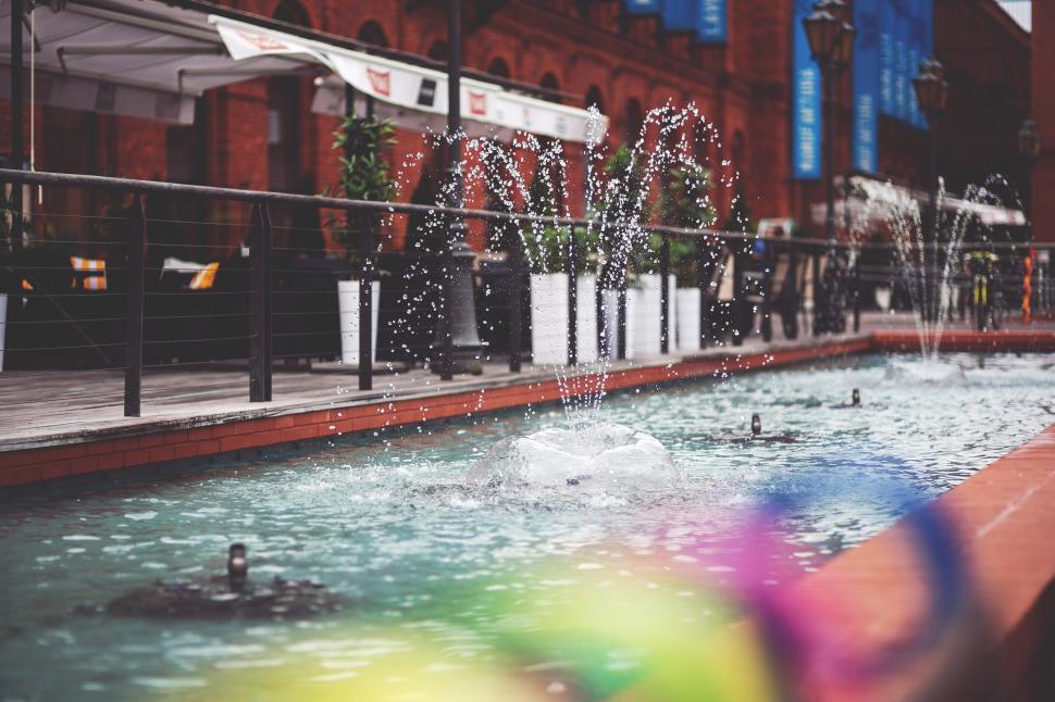 Free Image of Colorful Umbrella in Pool of Water 