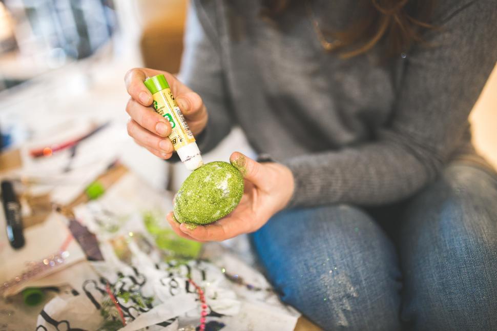 Free Image of Woman Holding Green Object 