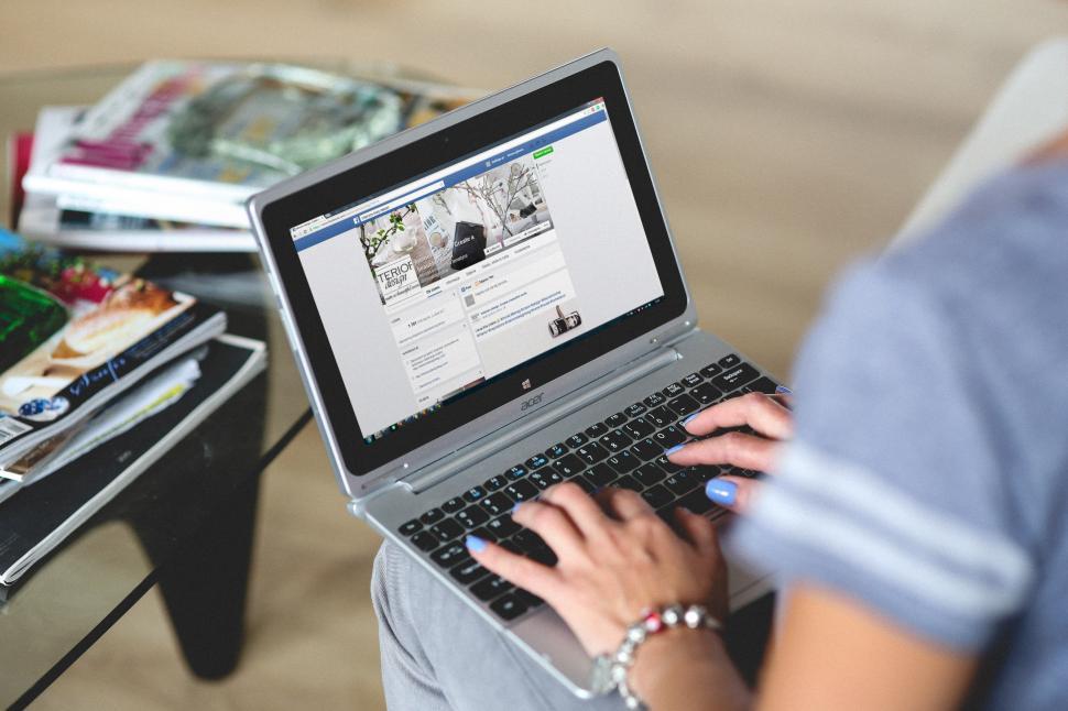 Free Image of Woman Using Laptop Computer on Table 