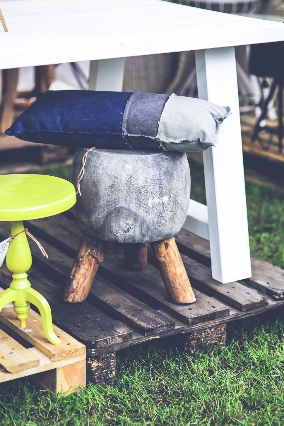 Free Image of Green Stool Under White Table 