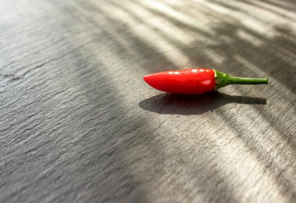 Free Image of Red Chilli Pepper Isolated on Stone Background 