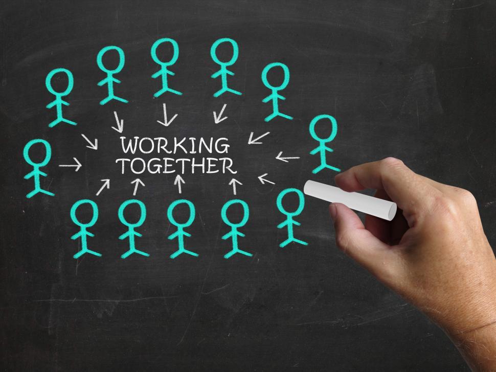 Free Image of Working Together On Blackboard Means Teamwork And Unity 