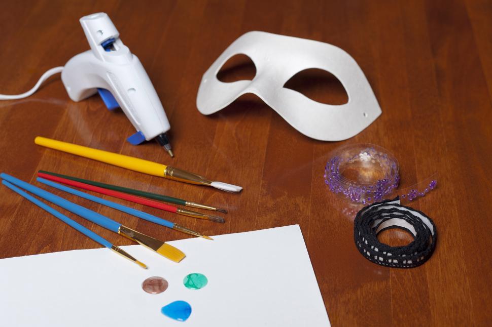 Free Image of Mask with paint and glue gun 