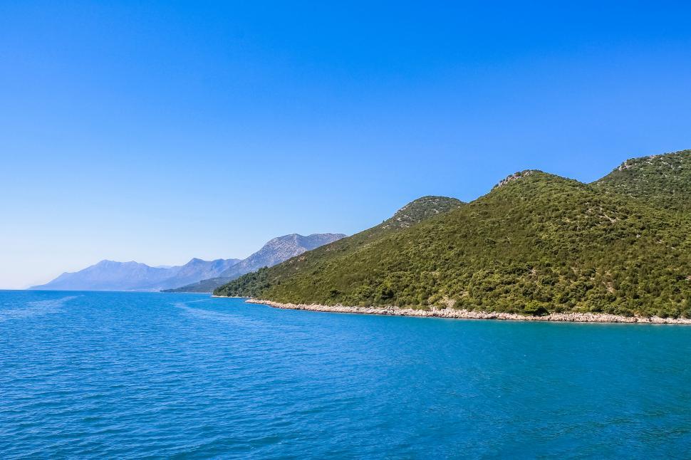 Free Image of Croatian coastline with blue water and hills  